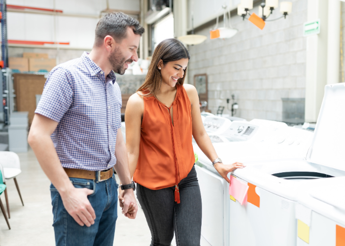 couple shopping for washing machine