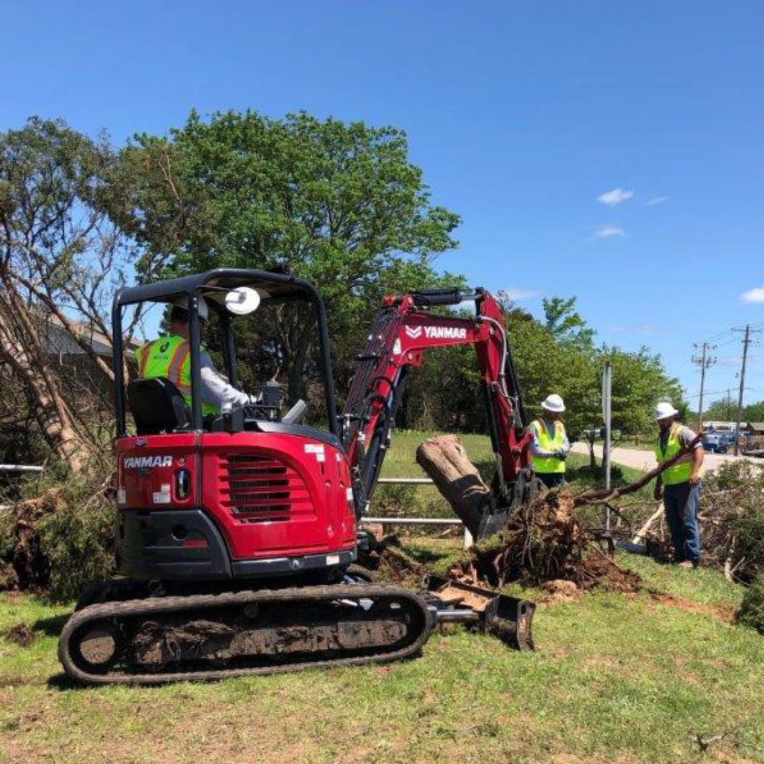 team cleaning up storm damage